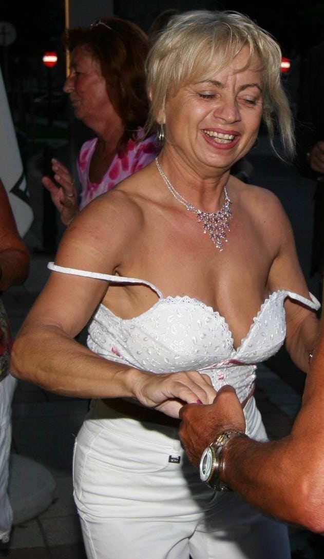 chris isenor recommends mature woman flashing tits aiden jarvis add mature woman flashing tits photo